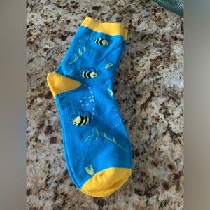 NWT Colorfully printed socks lending a "Bee" sentiment. Cotton, nylon, spandex.